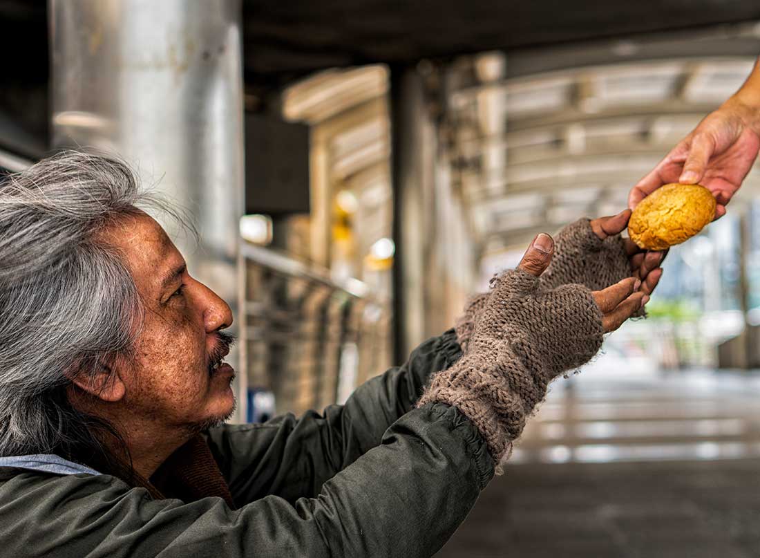 Poor person. Can stock photo homeless and hungry. Close up of depressed Senior man eating Bread..